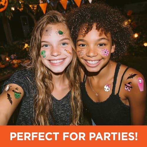 Two smiling girls with Halloween face paint and decorations.