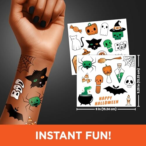 Arm with Halloween-themed temporary tattoos including pumpkins, ghosts, and bats.