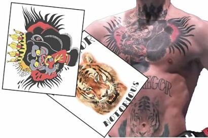 Tattooed chest with lion and tiger designs.